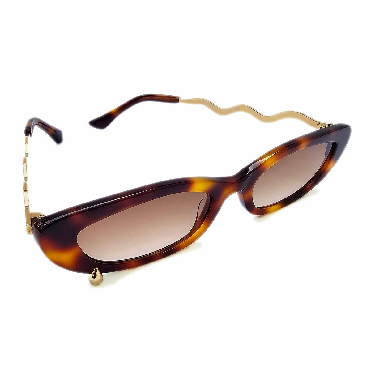 Tortoiseshell cat-eye sunglasses with brown gradient lenses and gold-tone metal temples featuring a wavy design and decorative rivets, shown on a plain white background.
