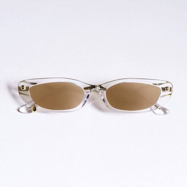 A pair of rimless cat-eye sunglasses with clear transparent frames and warm brown lenses, displayed on a clean white background.